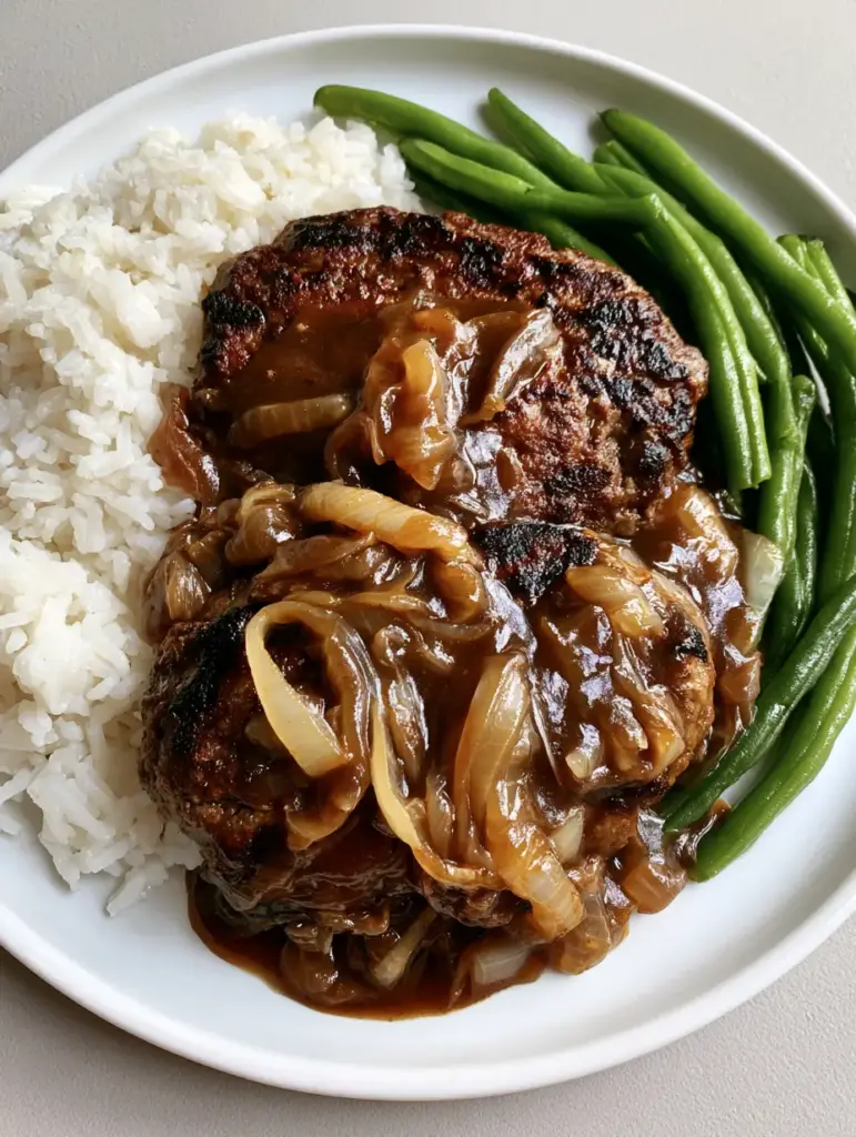 Handheld smartphone photo of Hamburger Steak with Brown Gravy, pale yellow onions, rice, and green beans.